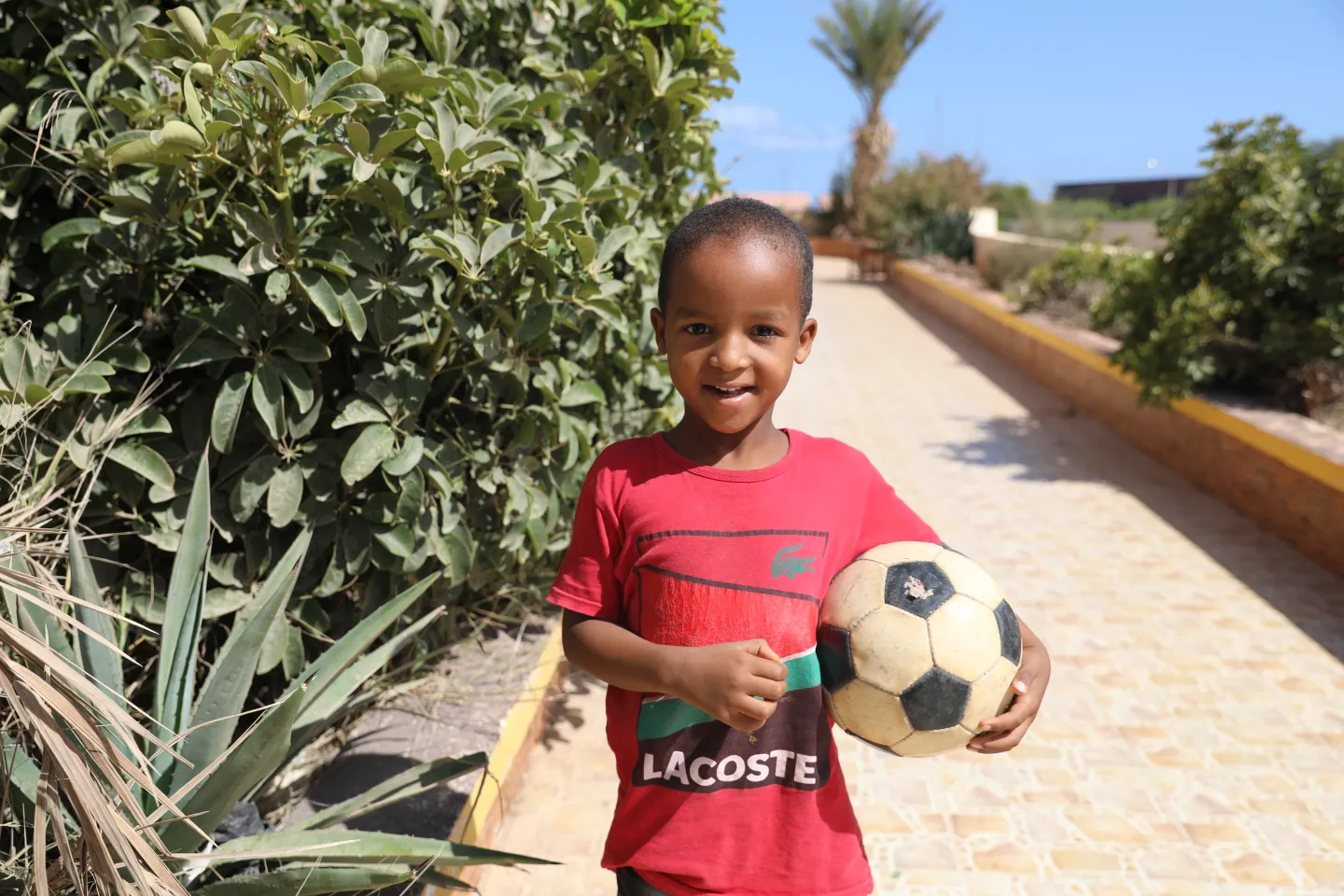 Portrait of boy holding football