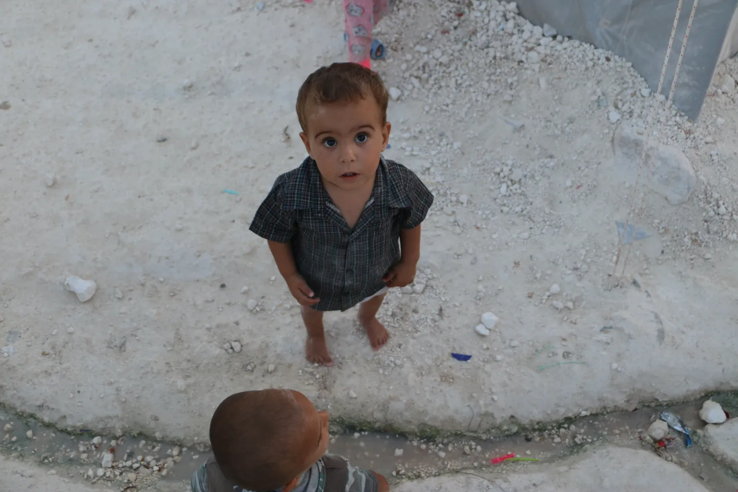 A child outside his tent 