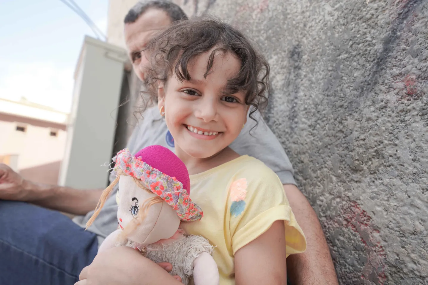 Girl holding doll - Libya Flood