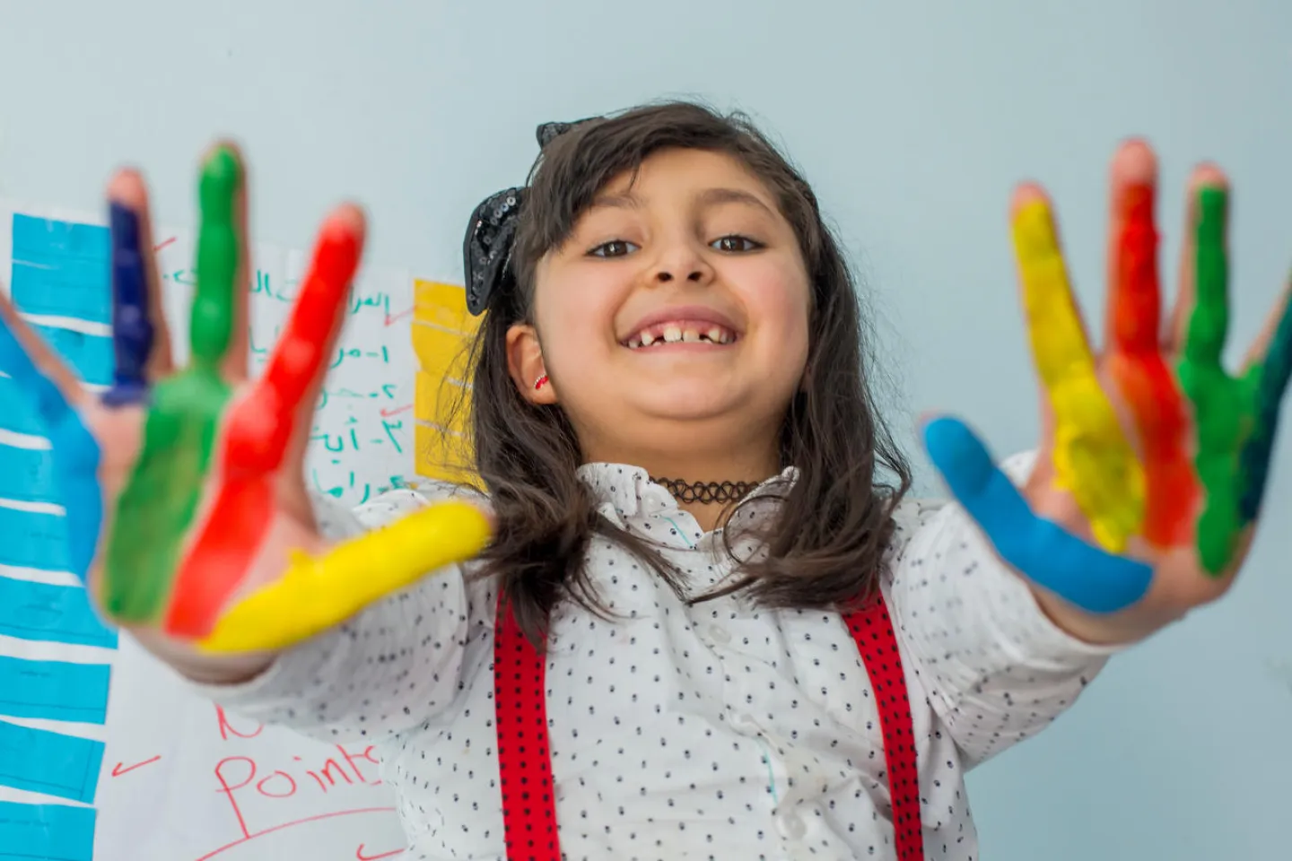 Zeina, 8 years, in a UNICEF-supported Makani centre in Irbid. Her favourite activity is painting.