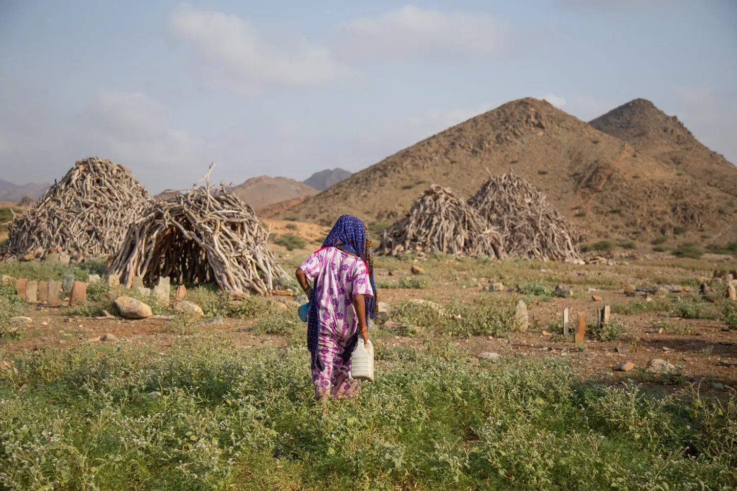 7-year-old Madina Mohamed Awad heads out to a creek in the small village of Gelhanty in Agig locality, Red Sea state, where she collected water in the past.