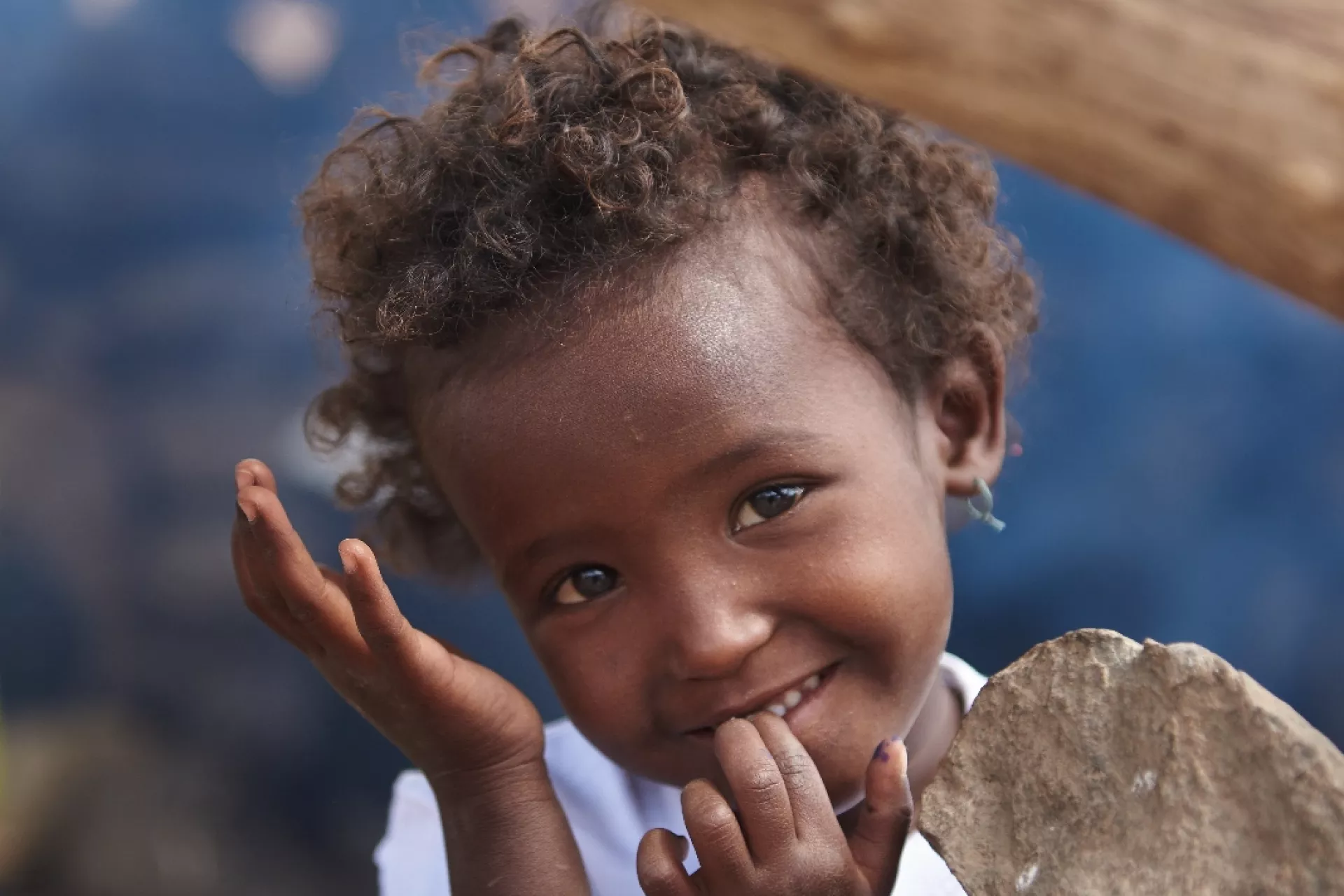 A young girl child smiles outside a UNICEF support school in the village of Abdoya. Djibouti.