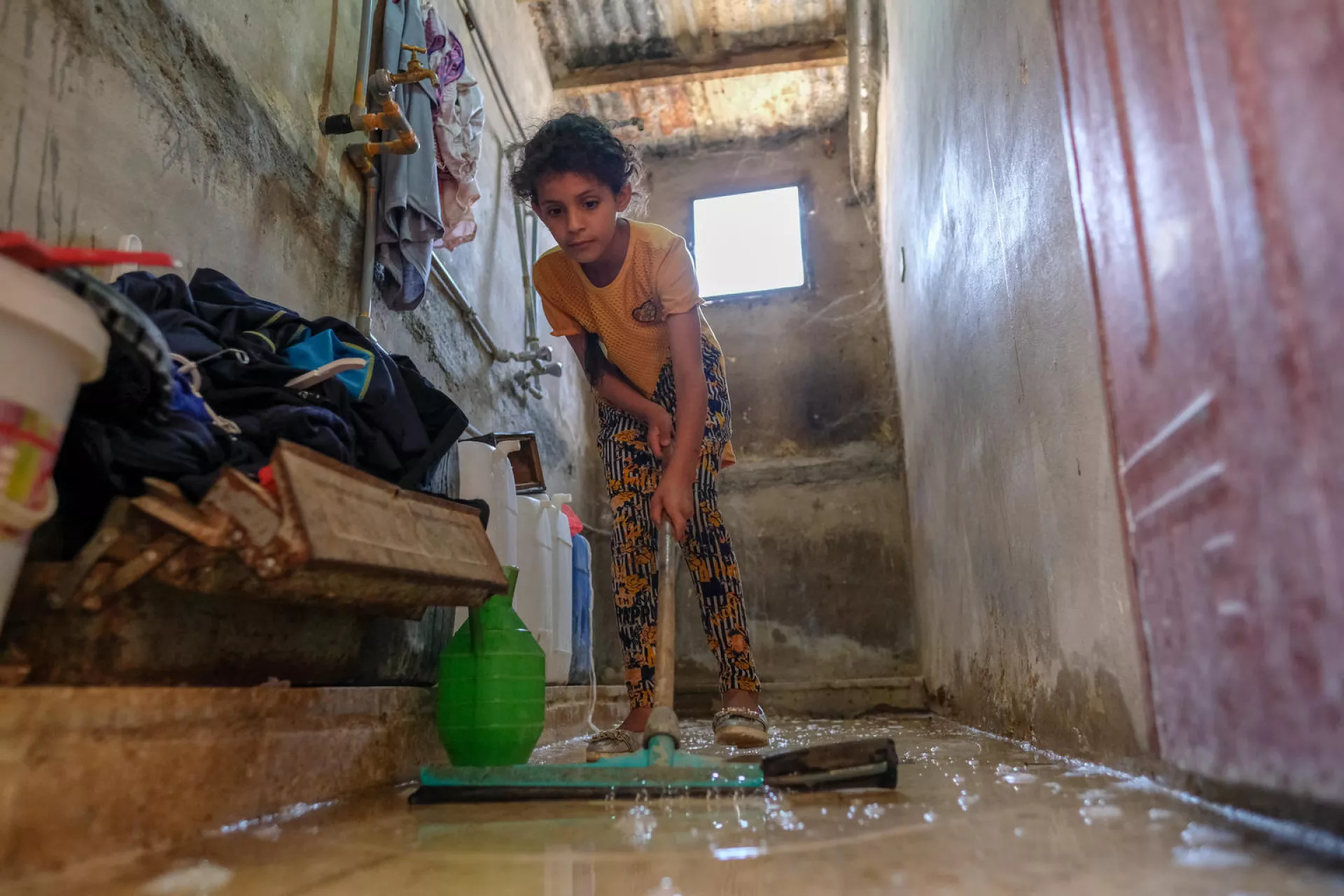 a girl cleaning the floor