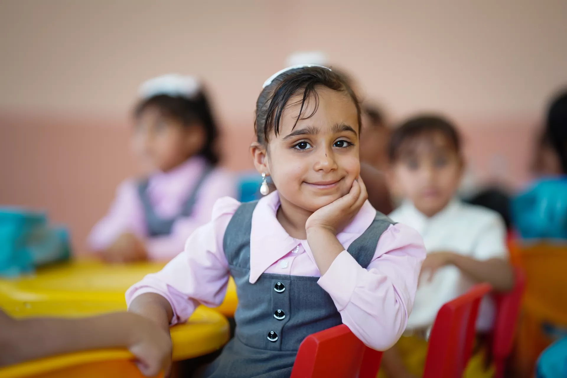 5 years old, ---- smiling to the camera in the ECE classroom in Salman Al-Mohamadi Primary School.   Funded by DAEWOO E&C , UNICEF is building pre-primary classrooms and equipping it with the necessary furniture, equipment, and school supplies.    UNICEF, funded by the Korean Committee DAEWOO E&C, inaugurated two Early Childhood Education (ECE) classrooms in Mohammed Sadeq Al-Sader and 17 Athar primary schools. The initiative, aligned with MOE's Early Childhood Education and Iraq National Education strategi