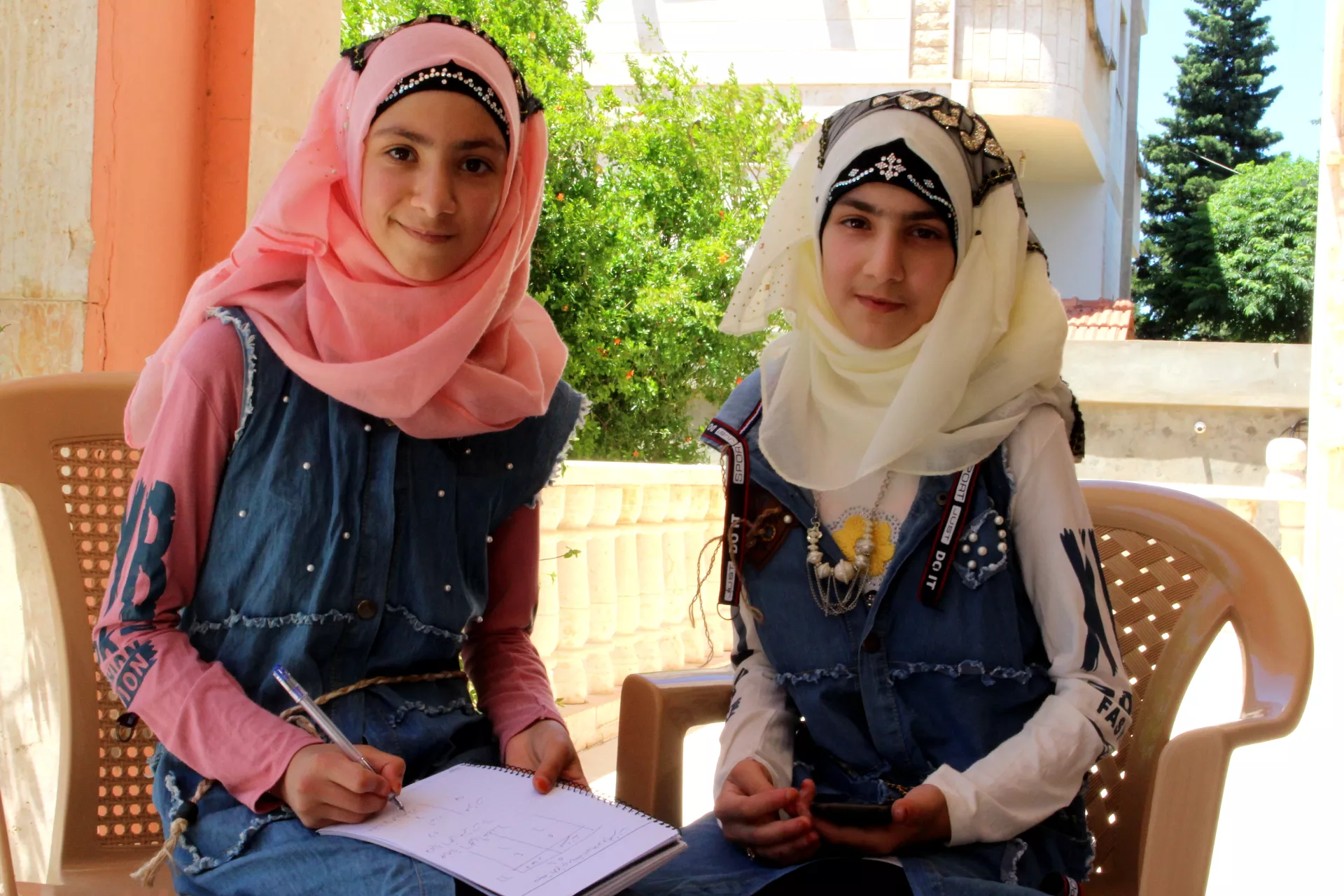 two girls studying