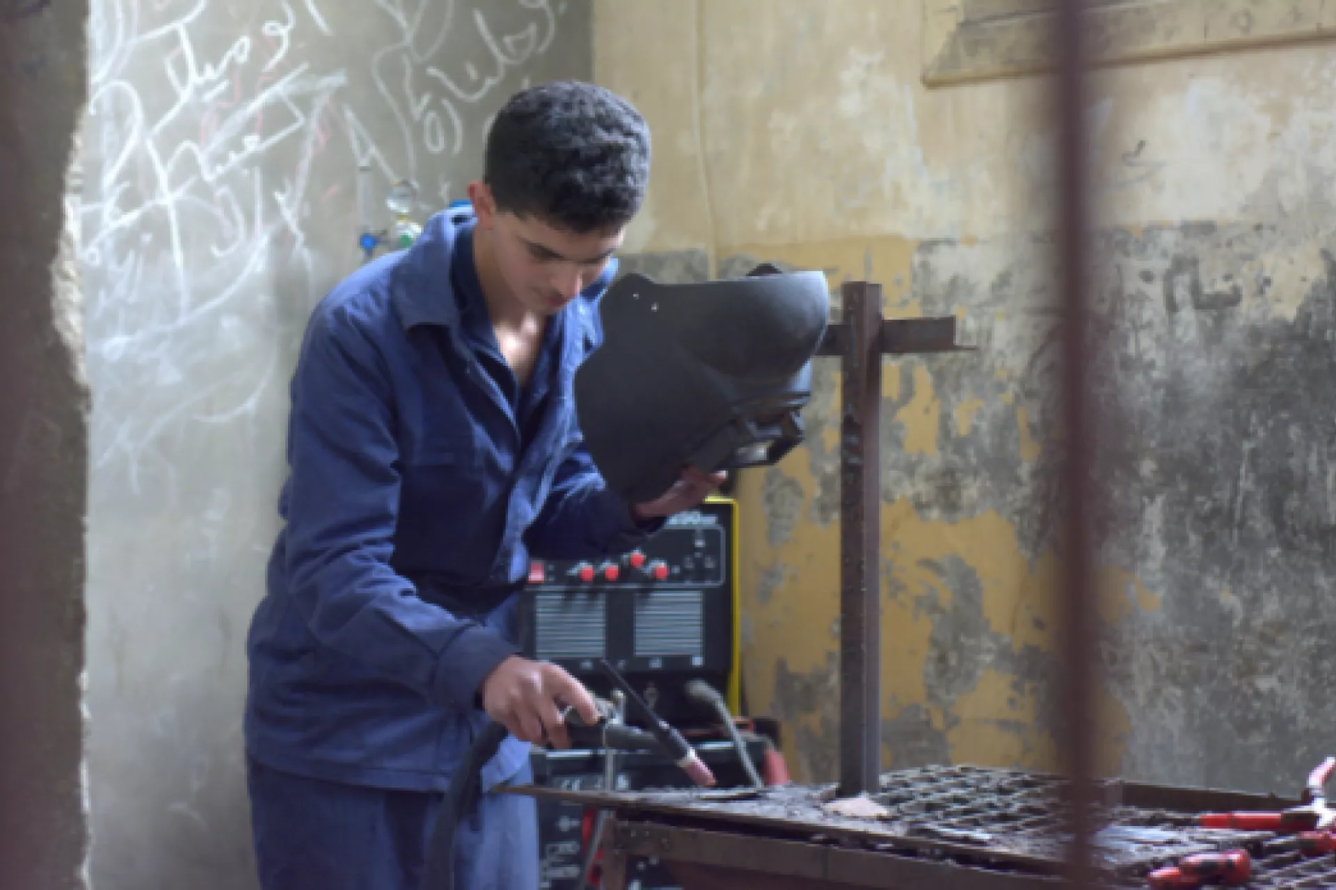 Boy at a technical school working