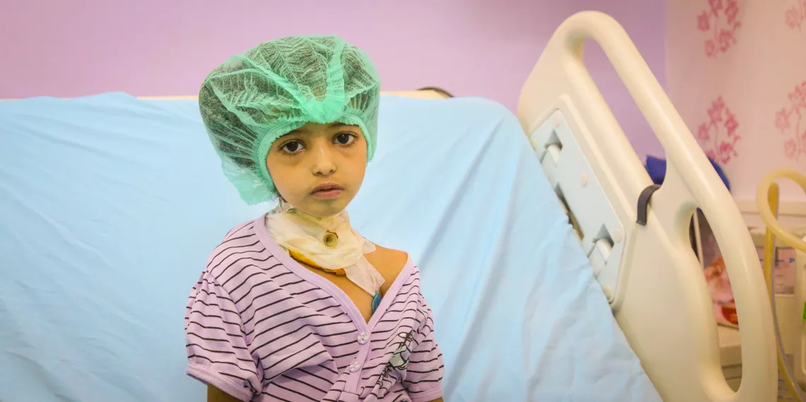 A girl in a hospital bed 