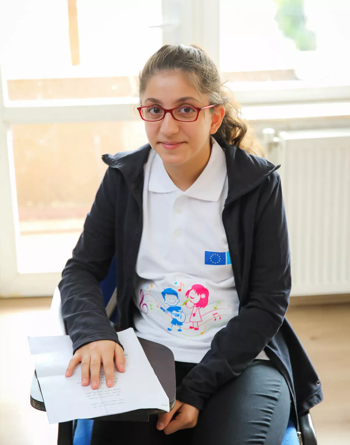 A girl smiling to the camera