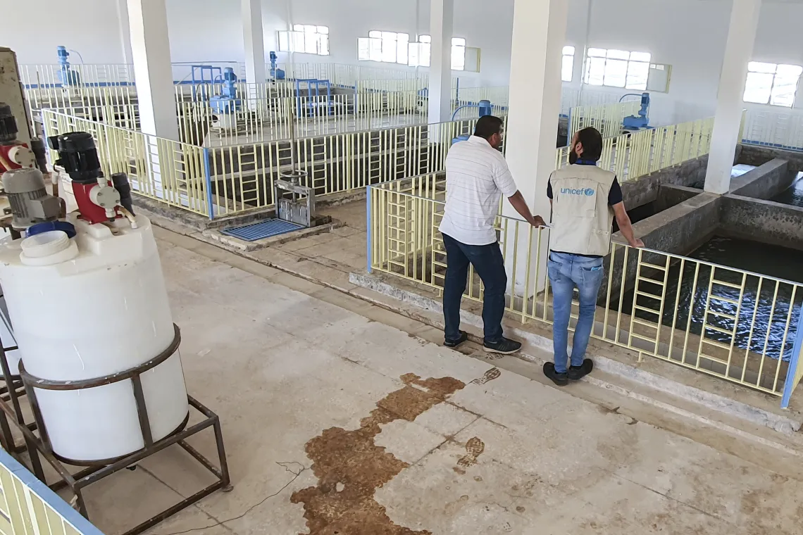 men-inspecting-water-treatment-at-pumping-station