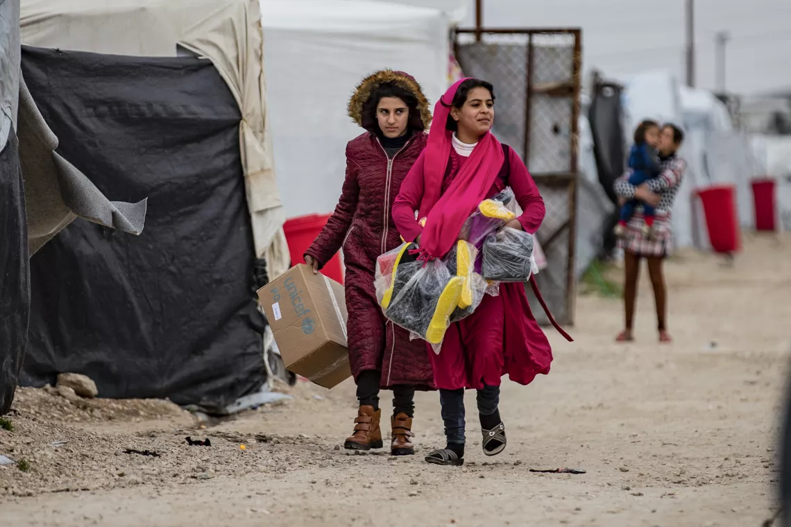 Children are happy to receive their new winter clothing kits distributed by UNICEF in Roj camp, northeastern Syria.