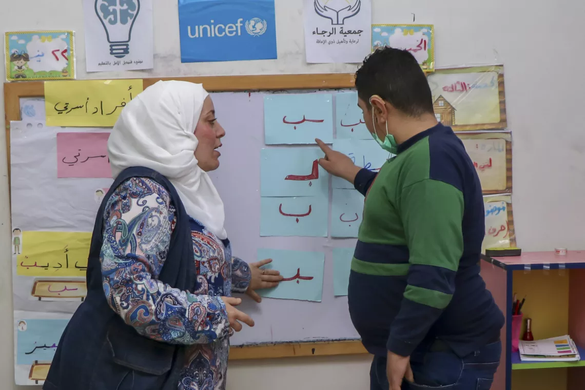 A number of children with disabilities attend a self-learning class at a UNICEF-supported center in Alkaterji neighborhood, Aleppo city, Syria.