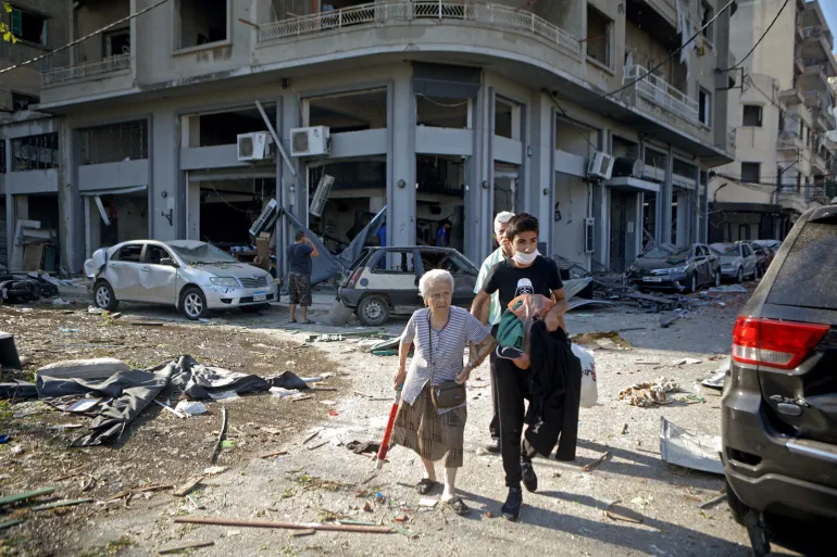 people getting away from rubble