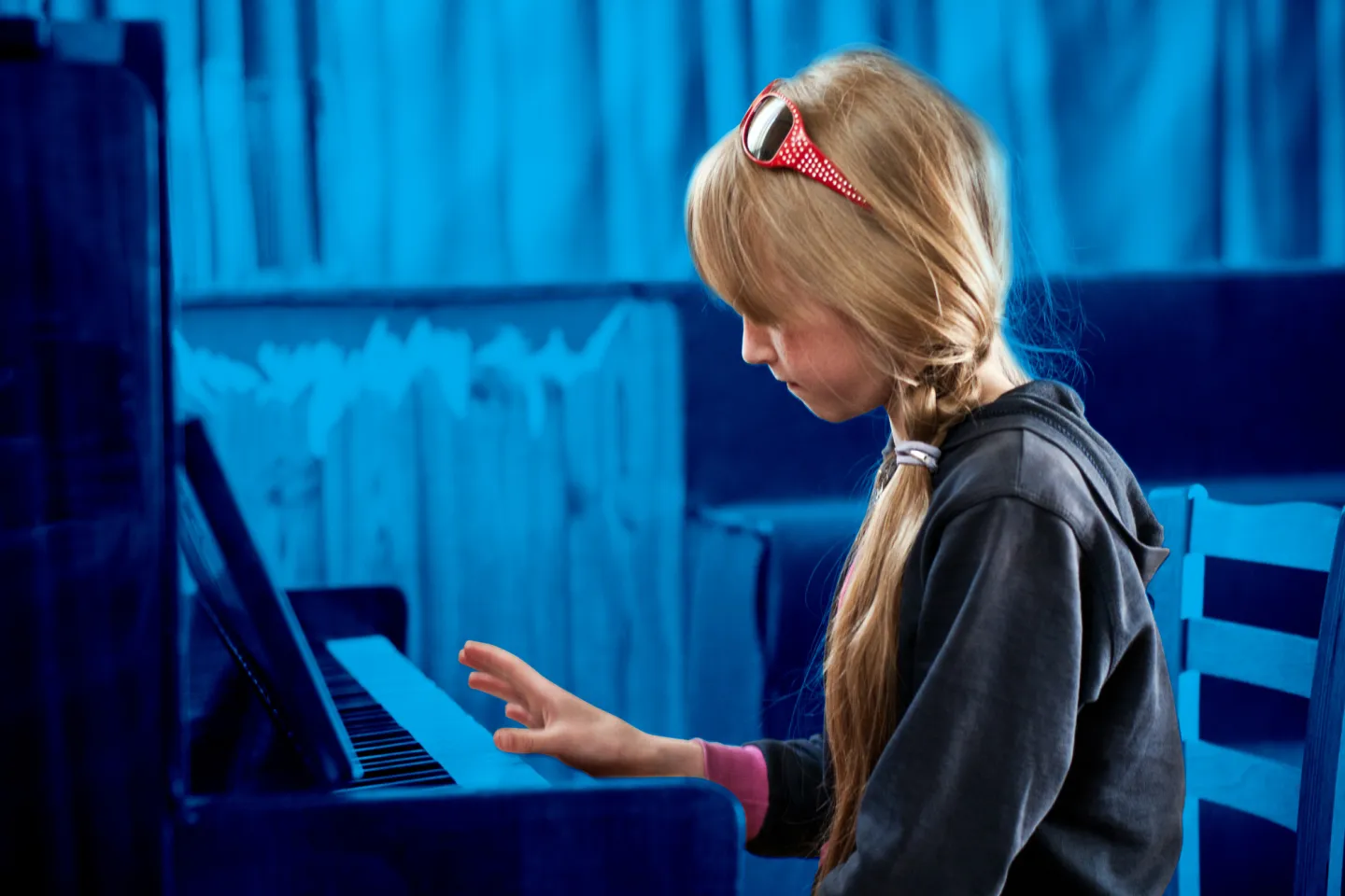 girl playing piano in a residential institution, Moldova