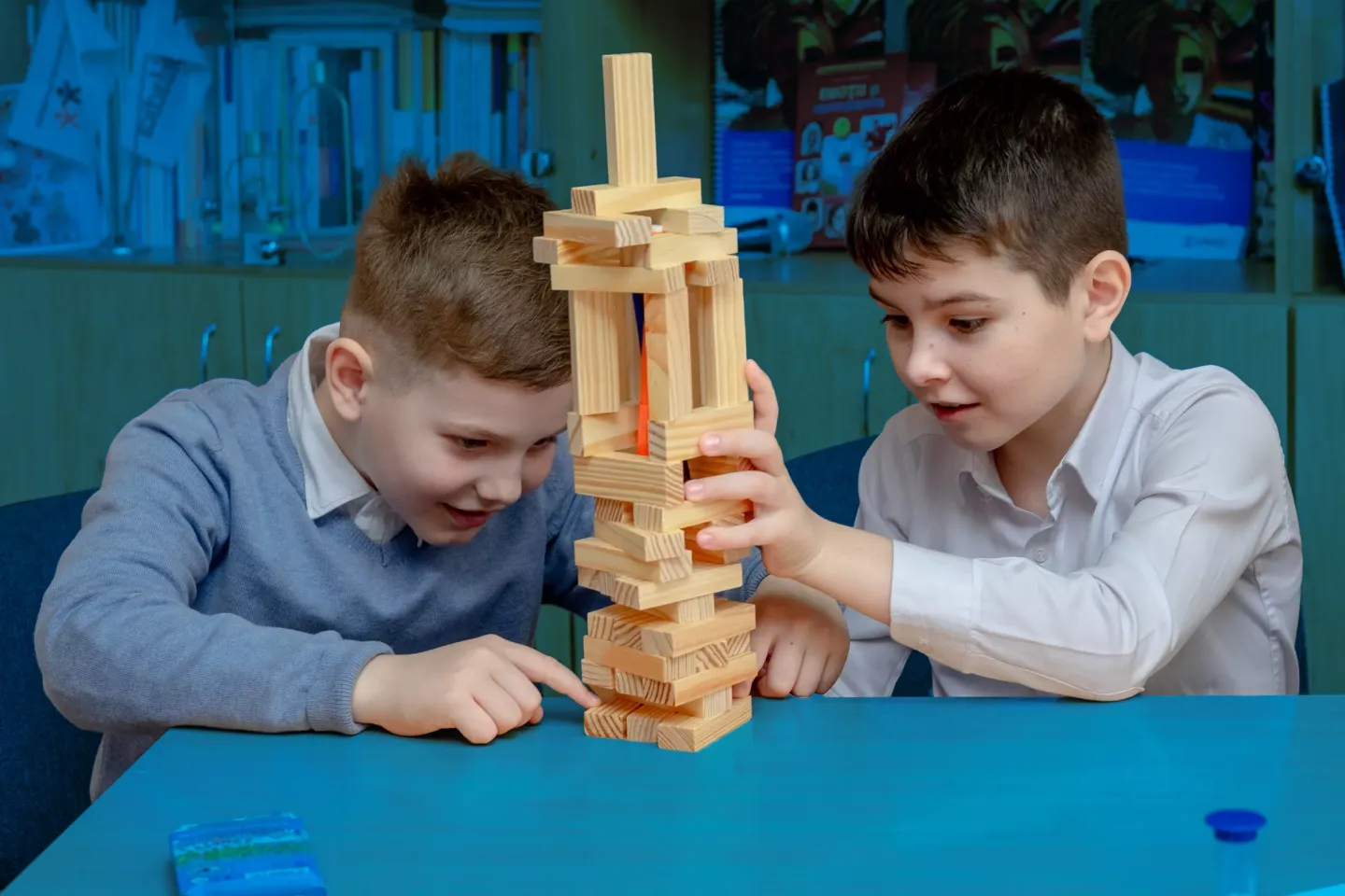 Two students playing in a classroom