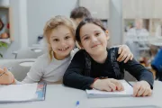 Refugee children learning romanian