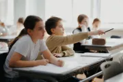 Refugee children learning romanian