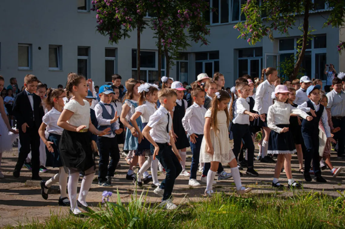 Children celebrate the last day of the school term.