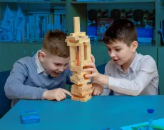 Two students playing in a classroom