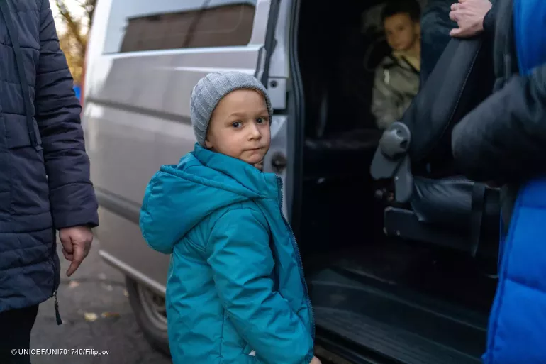 19 November 2024, Donetsk region, Ukraine. Four-year-old Mykhailo prepares to board a vehicle with his family to travel to a humanitarian hub in Pavlohrad, leaving behind their home in Shevchenkove, Donetsk region.