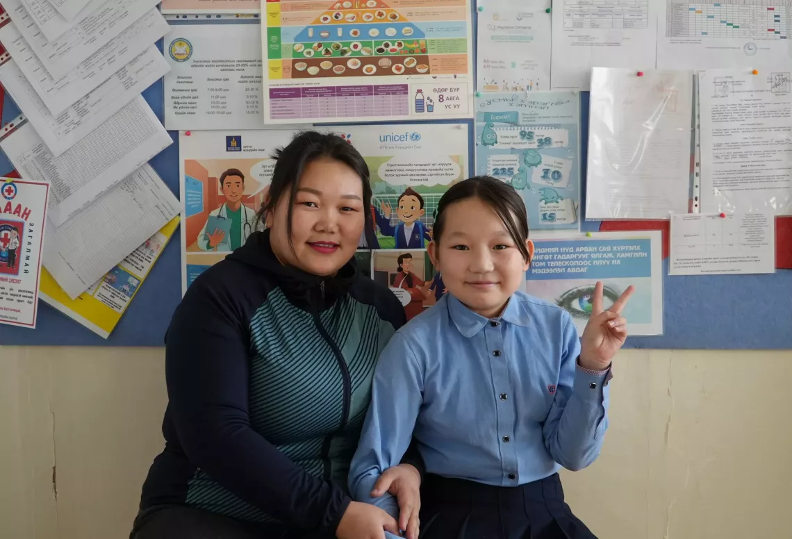 Enkhjin with her mother at the school doctor&rsquo;s room in Orkhon province.