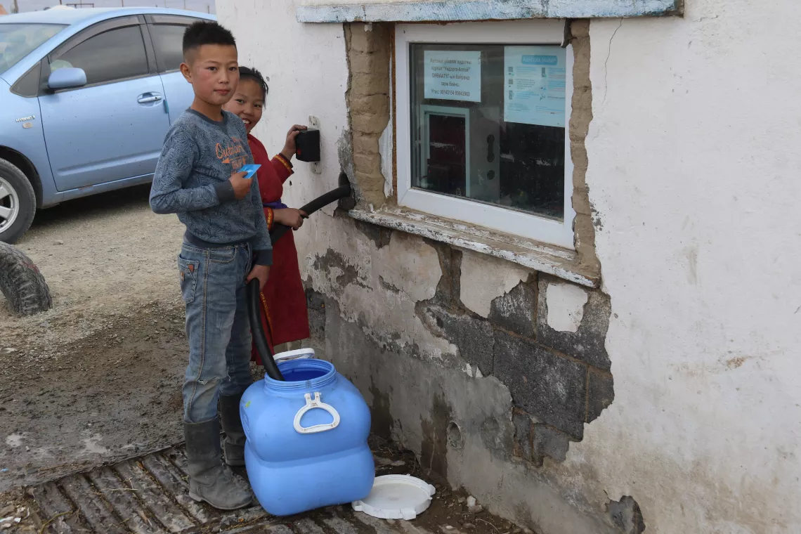 collecting water from the smart kiosk