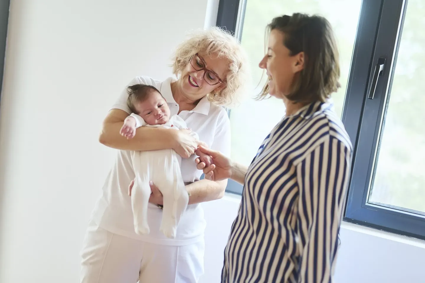 Home-visit nurse Vesna with mother Ana and baby Luka