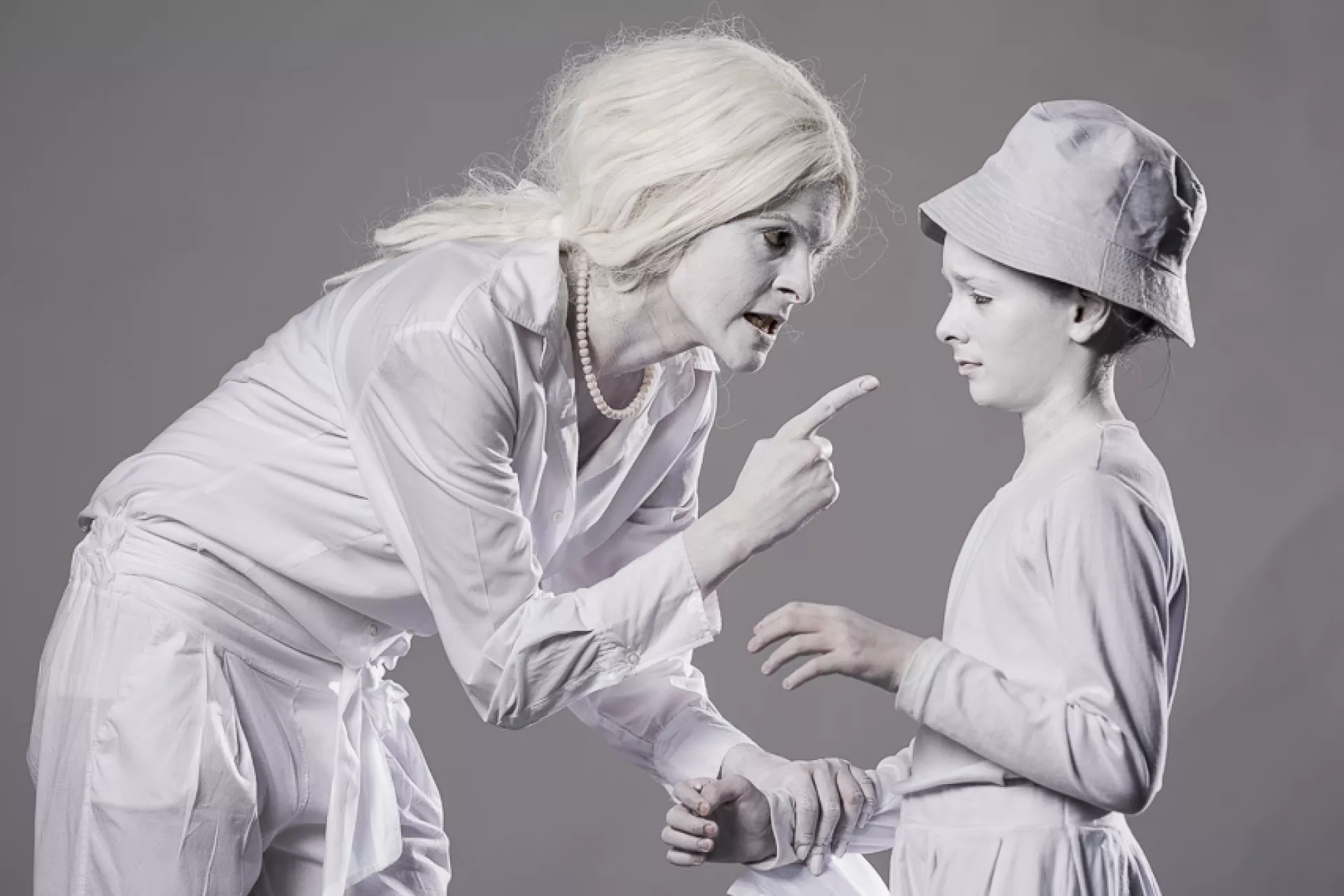mother threatening a child - white statues campaign photo