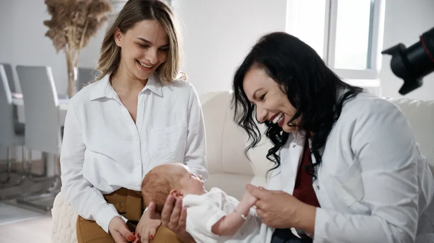 A mother and a nurse with a baby