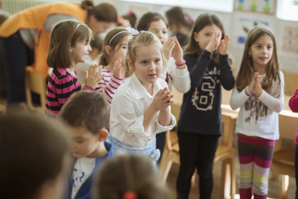  Five-year-old Kalina dances with her peers in kindergarten