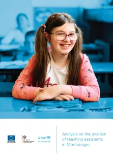 A girl sitting in the classroom and smiling