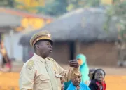 A government official addresses the gathered community during the dialogue in Horta-C, following the ASCHA performance.