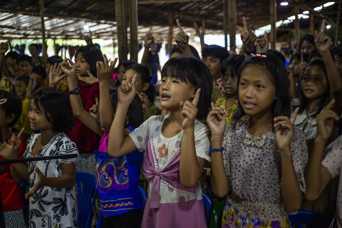 A group of young girls signing together. 
