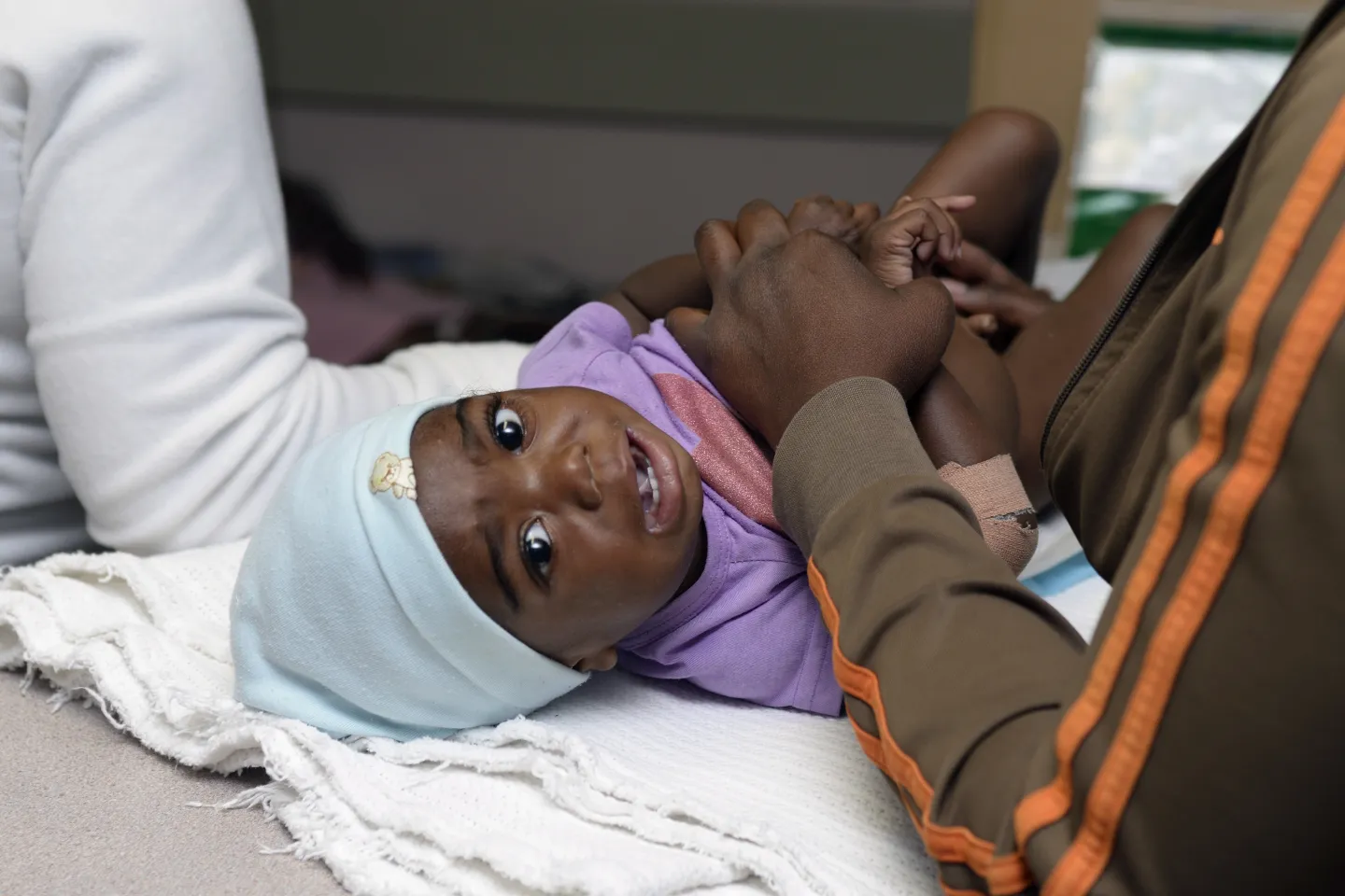baby at hospital examined for malnutrition