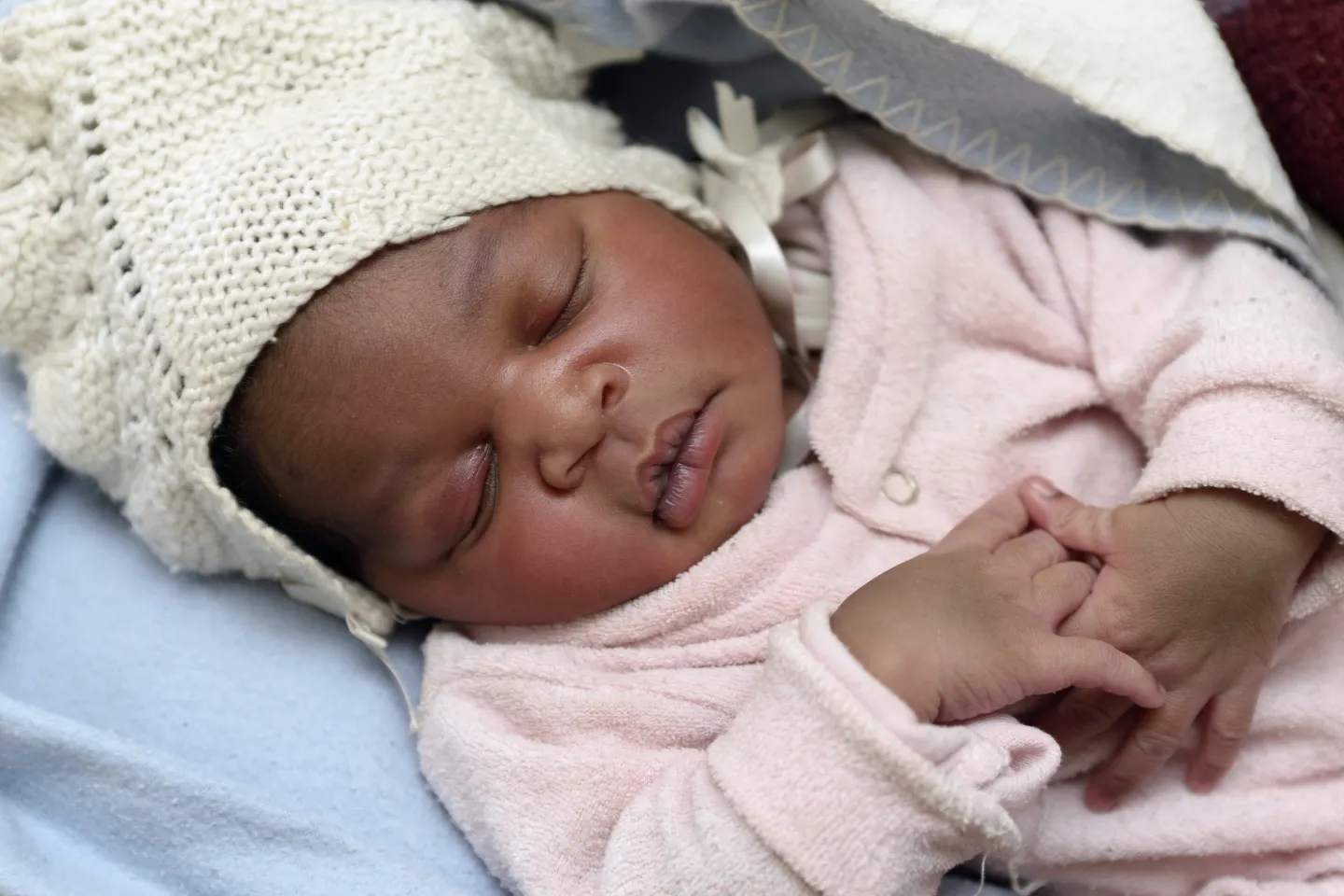 Baby girl sleeping during routine check at health centre