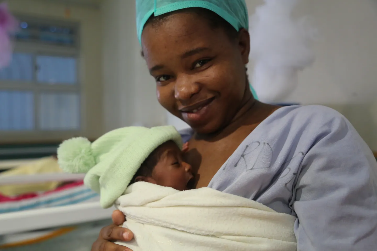 Mother practicing kangaroo mother care with newborn