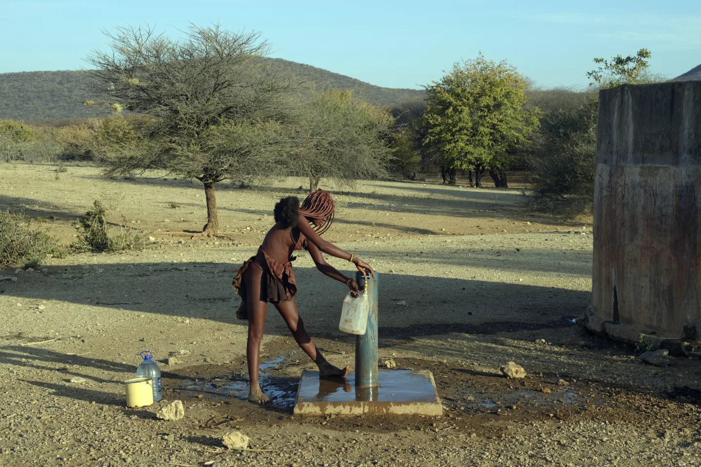 Himba girl fetching water