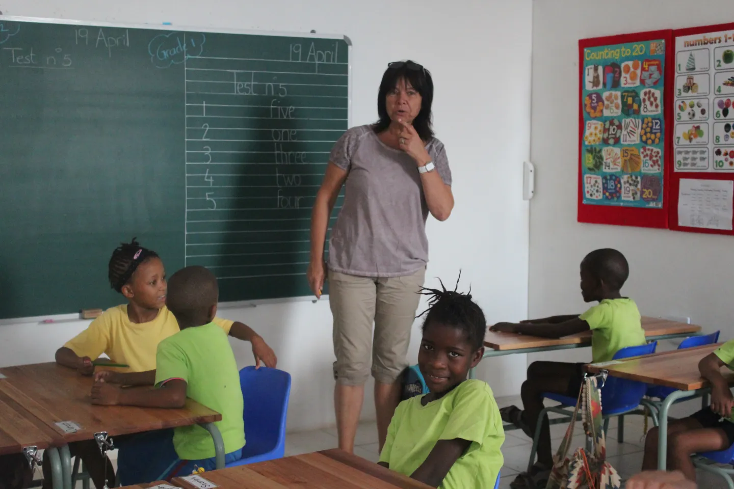 Teacher in classroom with children