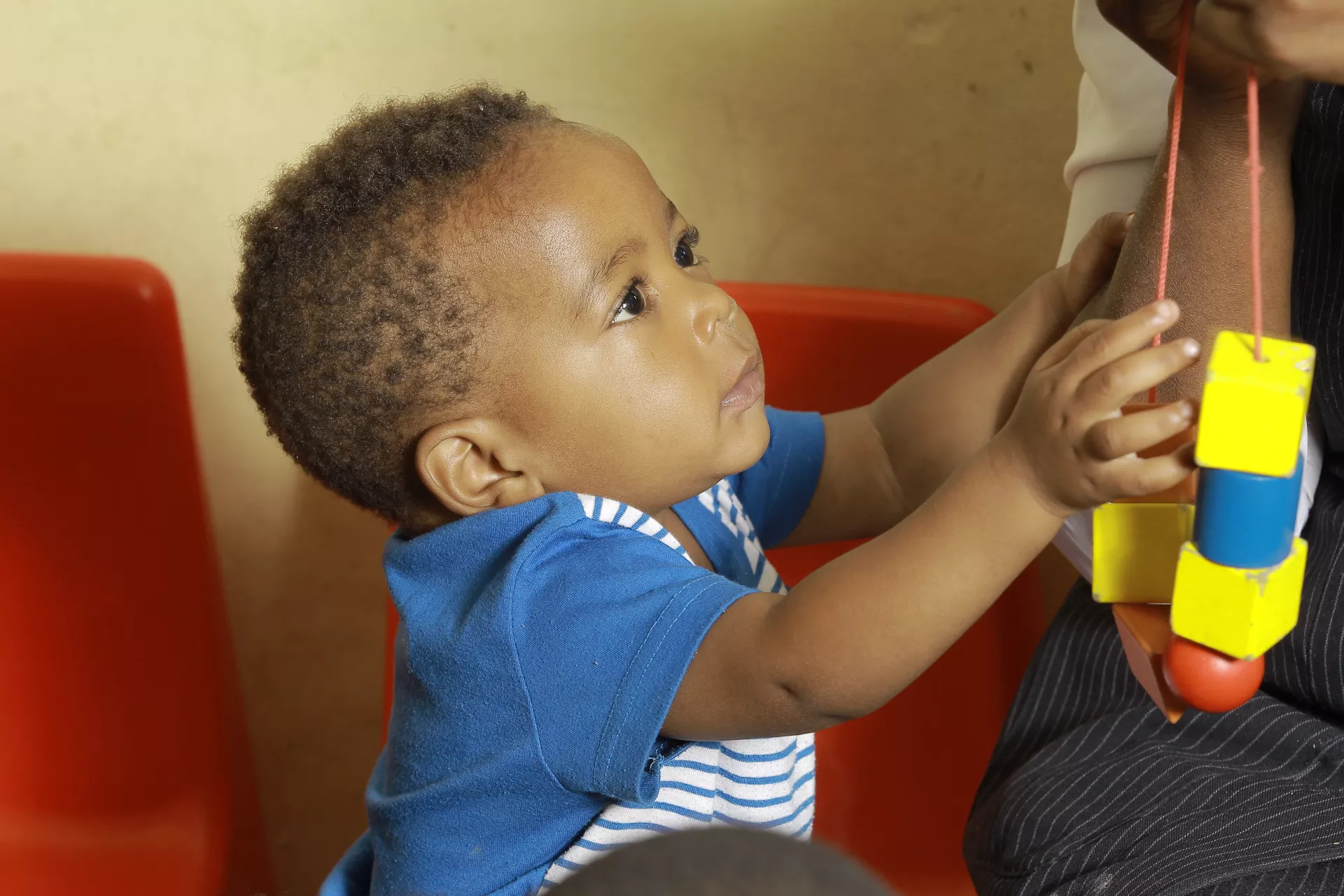 baby boy playing with blocks at early childhood development centre