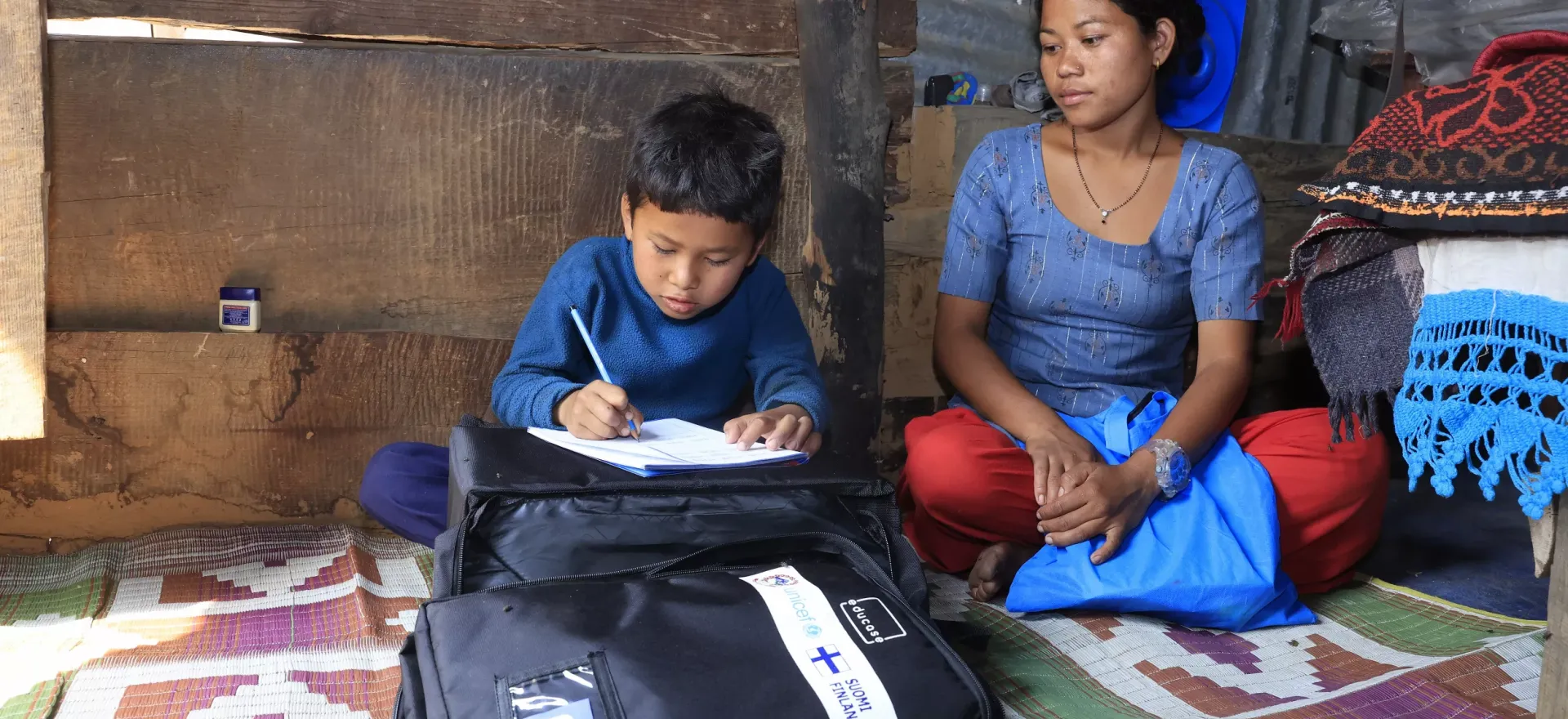 A mother happy to see her son study comfortably with Educase bag