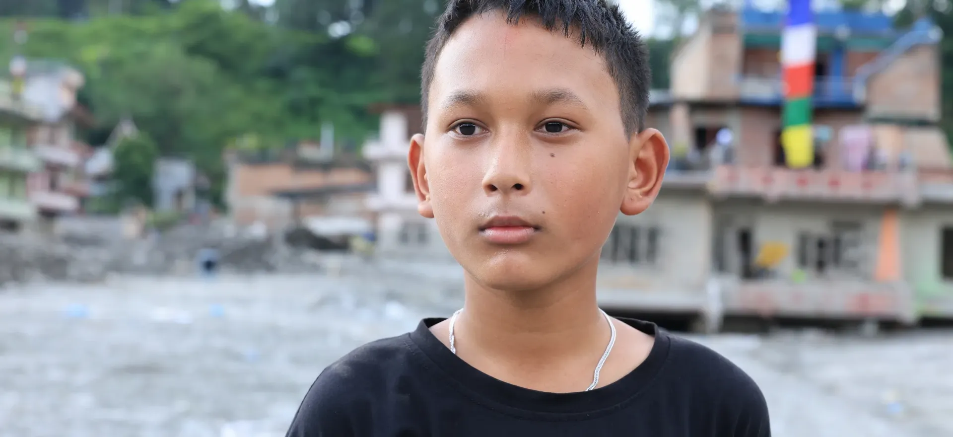 On 21 September 2026, Susin, 12, is in his flood-affected neighbourhood in Nuwakot,
