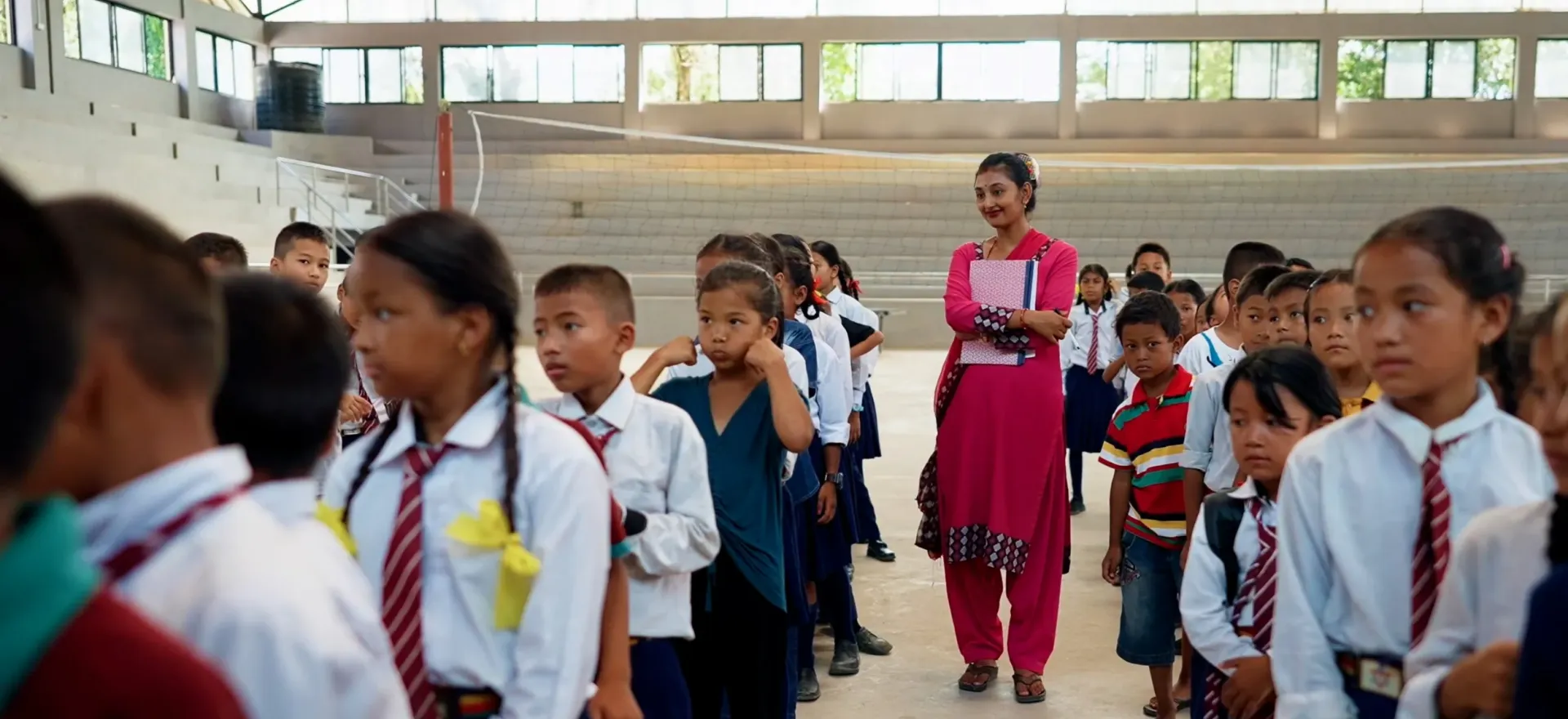 Narayani Bogati, primary teacher at Tribhuvan Trishuli Secondary School, teaches students as they return to learning at a UNICEF-supported temporary learning centre at the school in Nuwakot