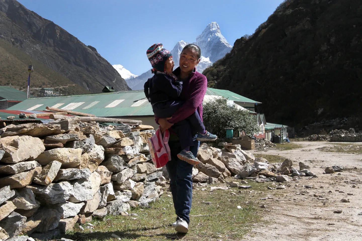 Mother and child outside Amadabalam