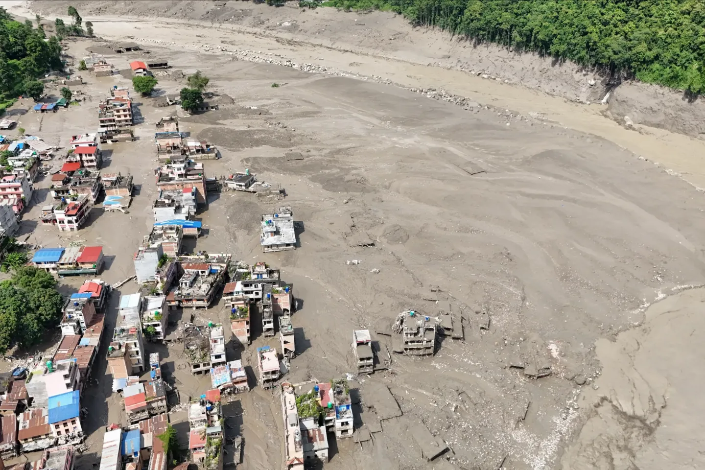 Views of settlements in central northern Nepal covered in mud following the devastating flash floods that swept through the area on 26 August, causing widespread destruction to homes, roads and other infrastructure.