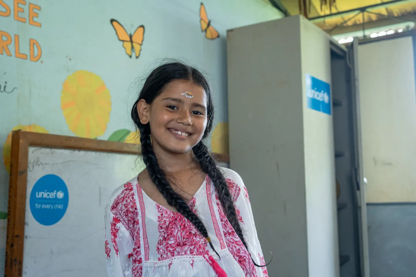 A portrait photo of Swostima Paudel in the newly set-up child friendly space. 