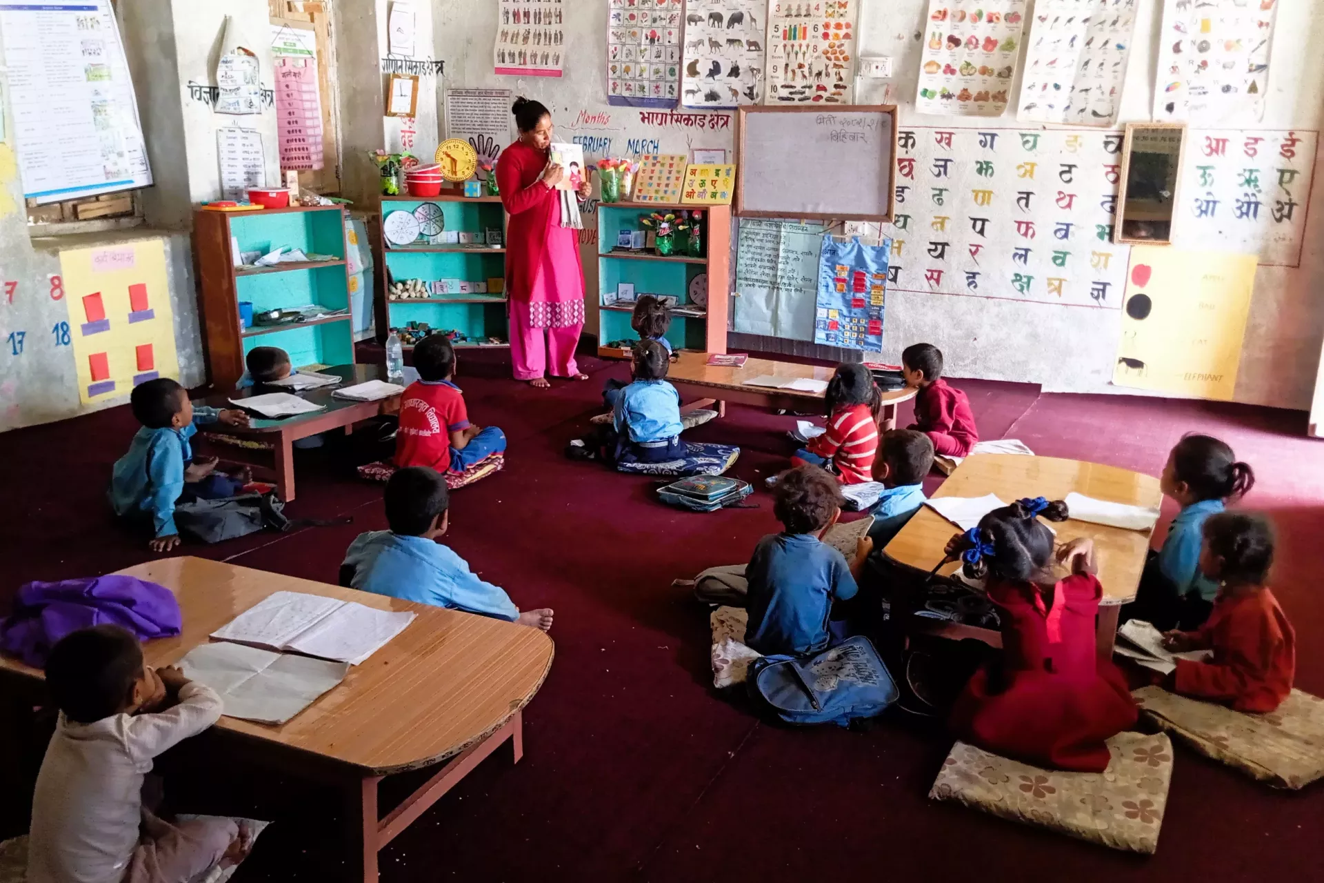Joyful minds at work! Early Childhood Education students dive into holistic learning with their inspiring teacher, Basanta.