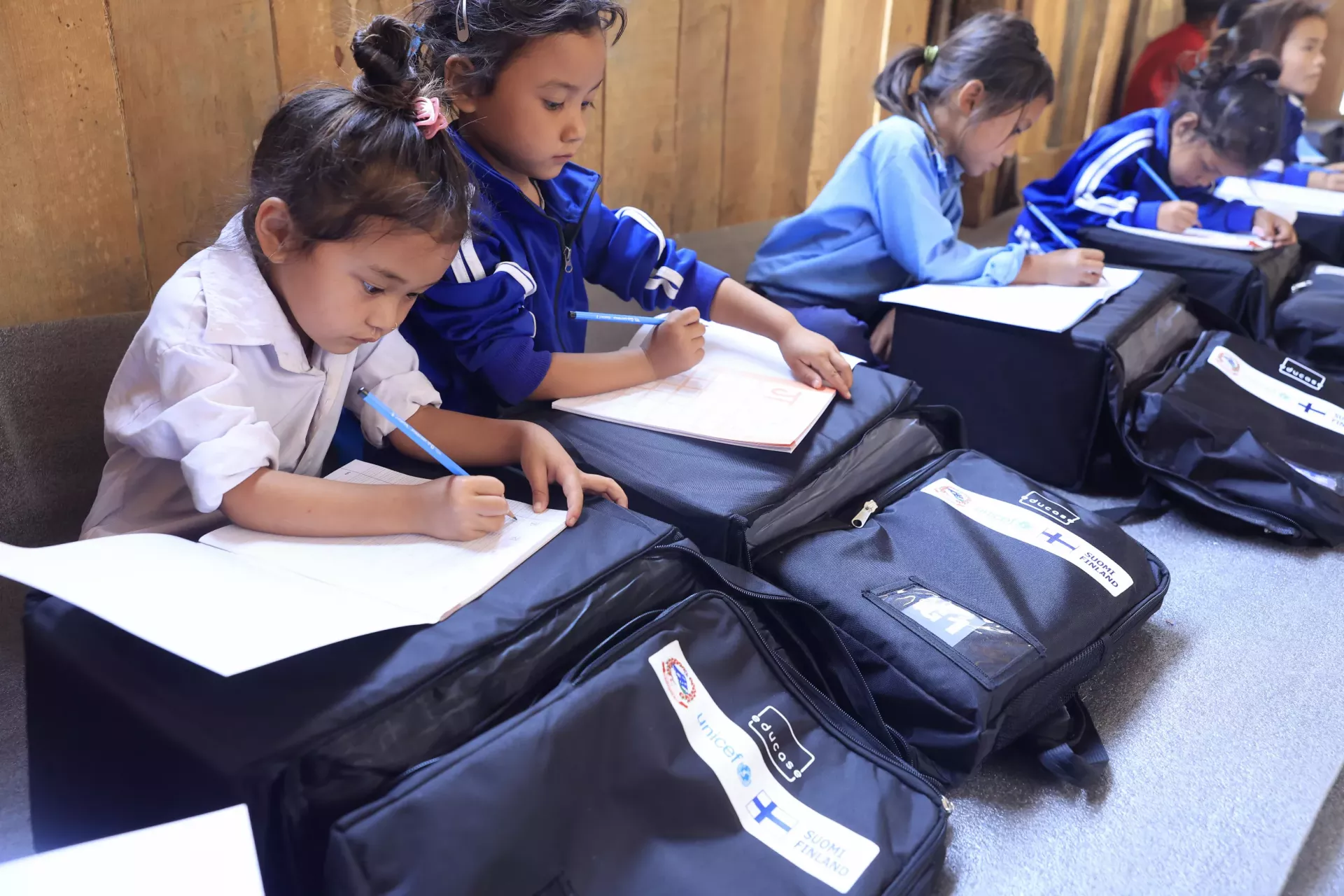 Children using the EduCase backpacks 