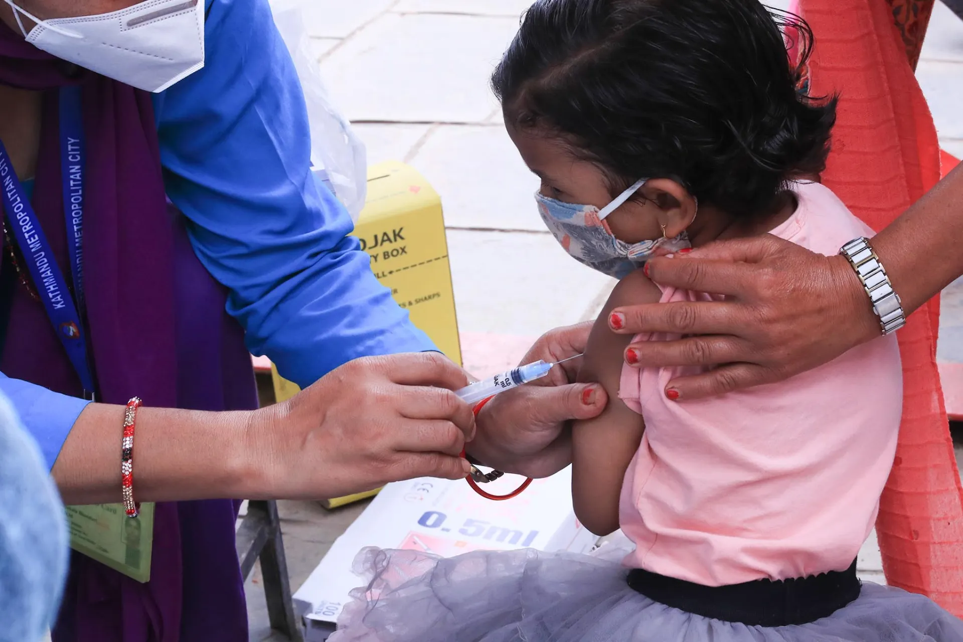 a child getting vaccinated in Nepal