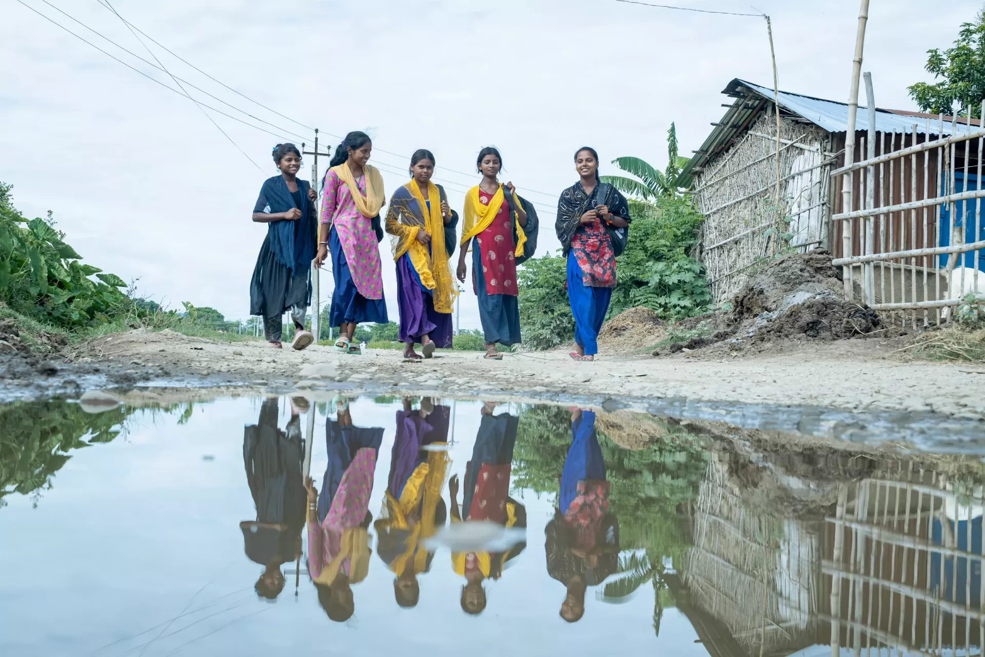 A group of girls walking on the road 