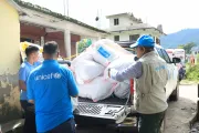 Emergency supplies are transported by vehicle to support flood-affected families and communities.