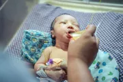 a child drinking donated milk